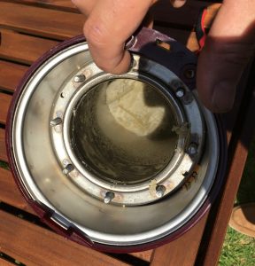 plumber opens heating unit filled with limescale